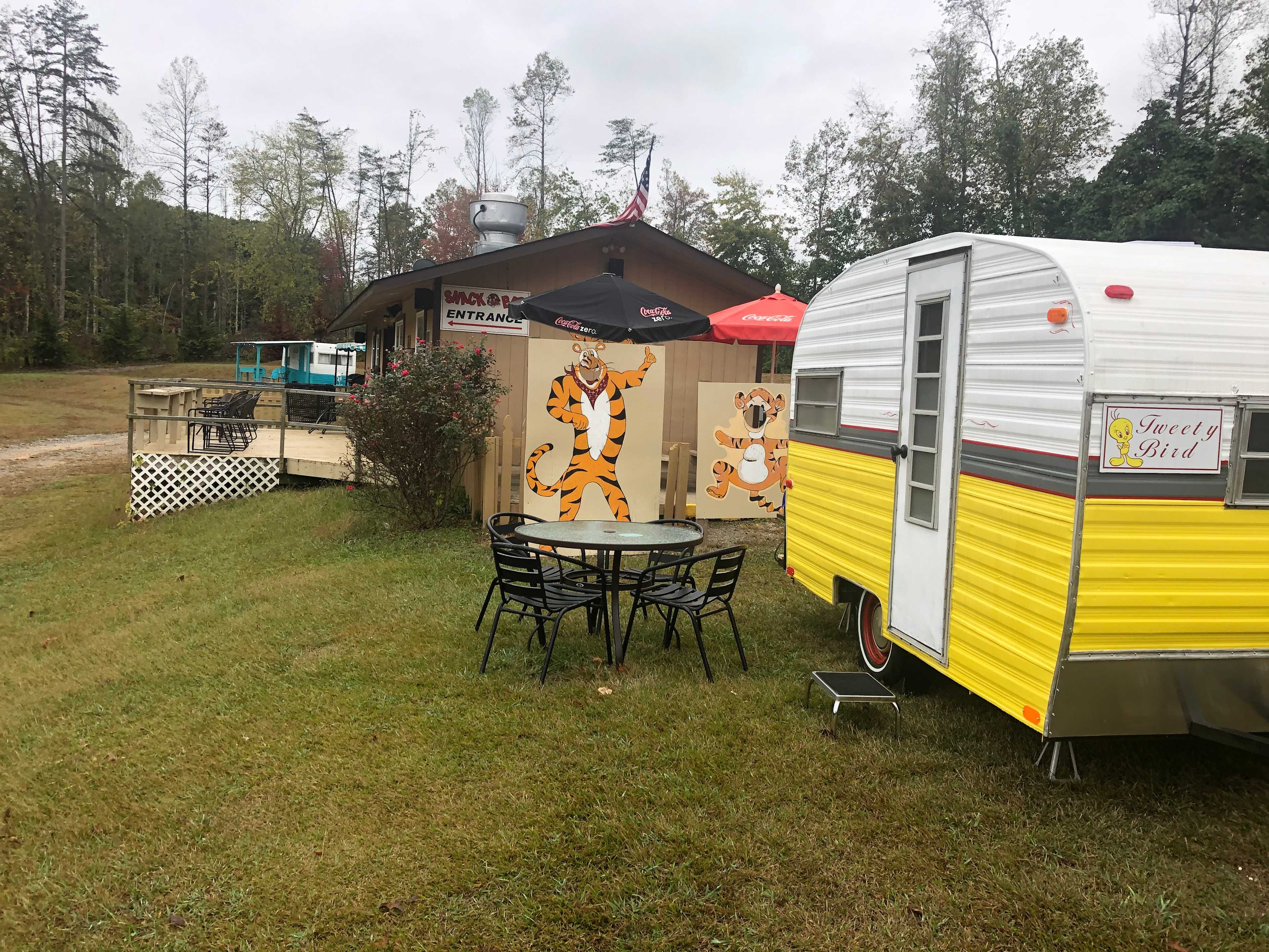 Tweety Bird camper with restaurant in the back ground