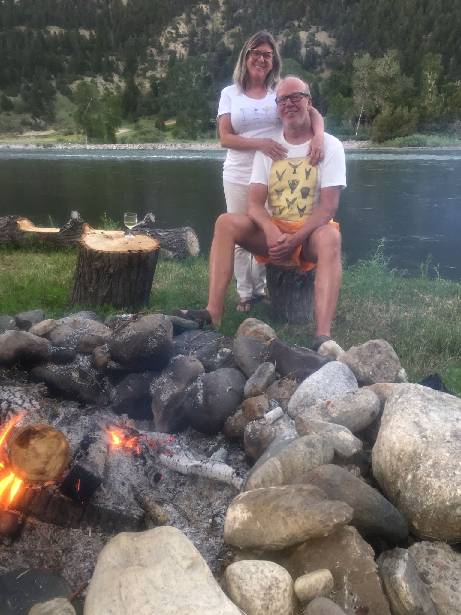 We are sitting at the campfire in front of our wooden deck on the Yellowstone River.